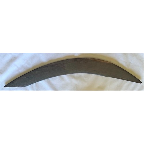 35 - Vintage Australian Boomerang with carved decoration, one tip missing (a/f), 54 cm wide.