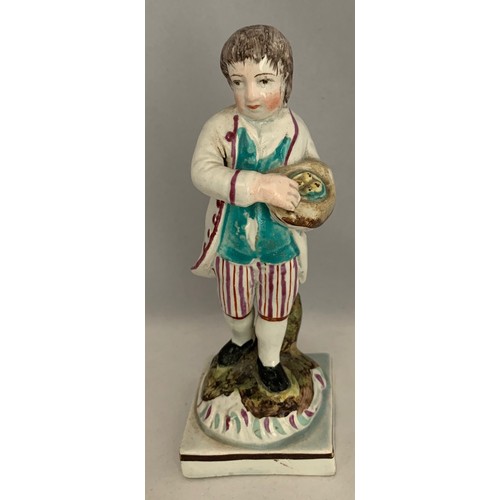39 - Staffordshire pearlware figure circa 1840, with polychrome overglaze enamels, a boy carrying a bird'... 
