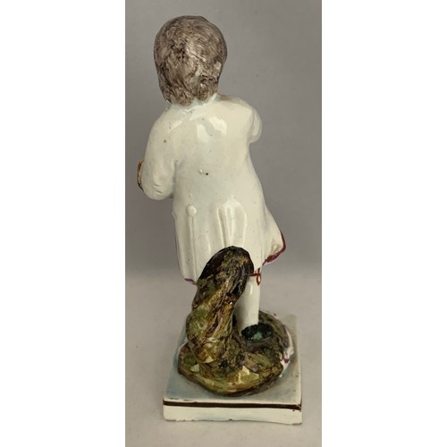 39 - Staffordshire pearlware figure circa 1840, with polychrome overglaze enamels, a boy carrying a bird'... 