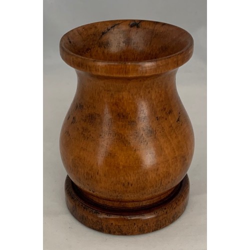 42 - Treen - An early 19th century turned pearwood dice shaker, 8 cm high, 5.25 cm diameter.