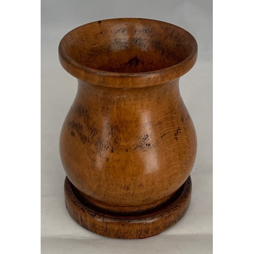 42 - Treen - An early 19th century turned pearwood dice shaker, 8 cm high, 5.25 cm diameter.