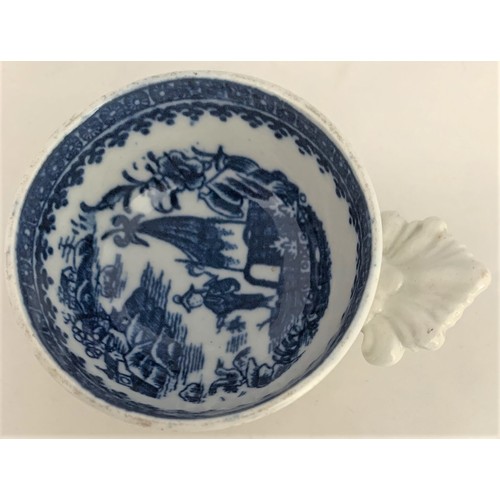 36 - A scarce Caughley English blue and white transfer-ware wine taster, circa 1790, decorated with the C... 
