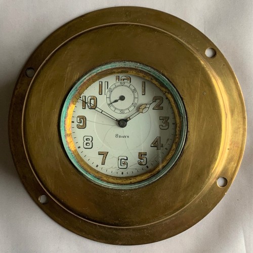 56 - Vintage brass car clock, the 6 cm diameter white enamel dial with luminous Roman Numerals and subsid... 