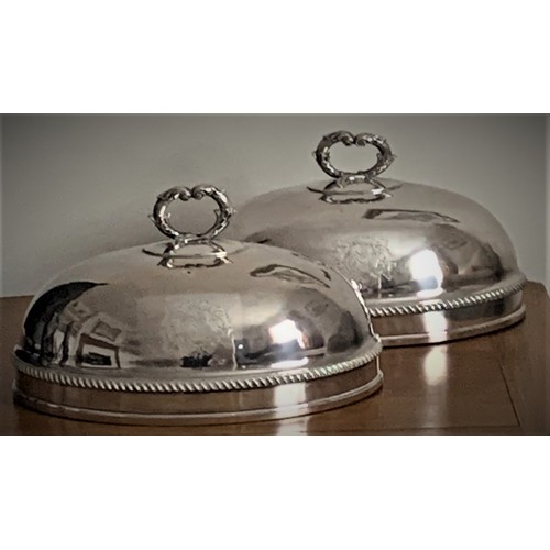 45 - Pair of silver plated food covers, late 19th century, with cast handles and engraved Armorials, 28 c... 