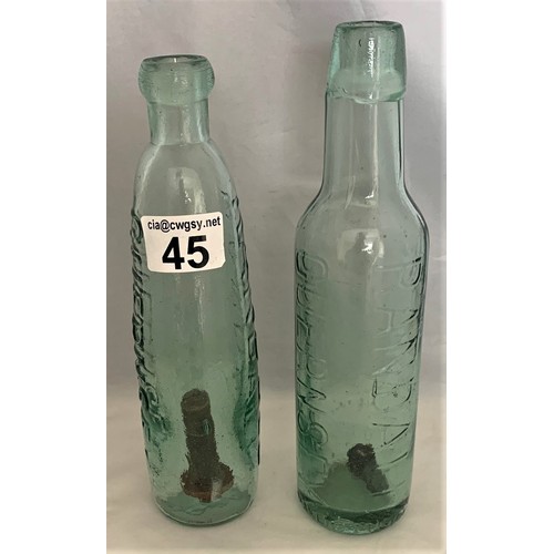 45 - Randall Guernsey glass bottle with stick plunger and crown top, P.& R. base 23.5 cm high, together w... 