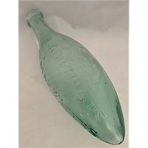 33 - A very rare clear glass Hamilton/Torpedo bottle, T.G. Reynolds Aerated Waters, Guernsey, 24 cm long.