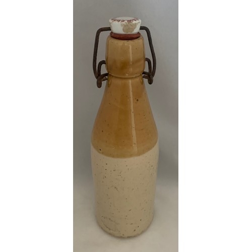 34 - Two tone stoneware bottle, E & W Guppy Old Fashioned Ginger Beer, Guernsey, 23 cm high.