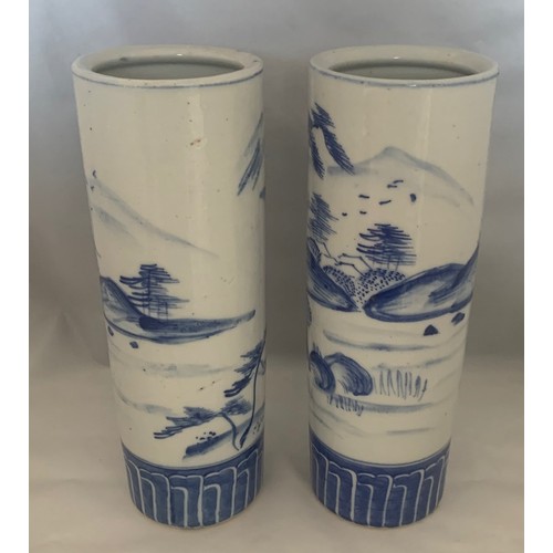 69 - Pair of blue and white decorated Chinese style cylinder vases, 26 cm high.