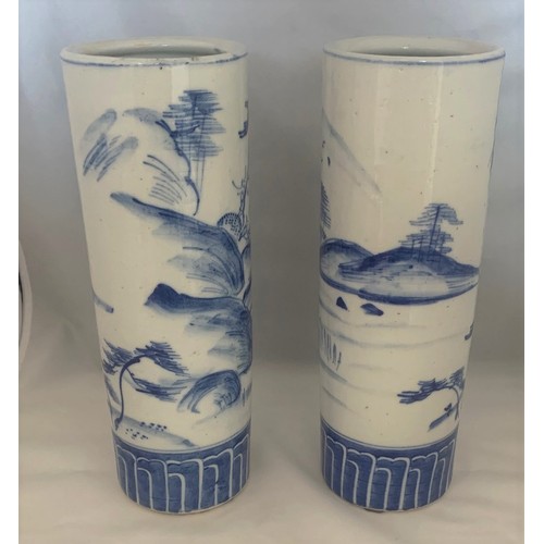 69 - Pair of blue and white decorated Chinese style cylinder vases, 26 cm high.