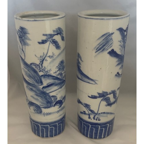 69 - Pair of blue and white decorated Chinese style cylinder vases, 26 cm high.