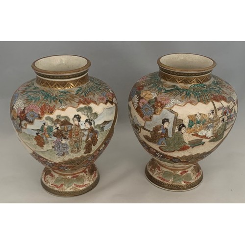 75 - Pair of Japanese Satsuma vases, Meiji period, of squat globular form, profusely decorated in gilt an... 