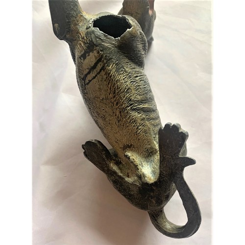 84 - A cold painted bronze model of a dog, one leg detached, 18 cm long, as found condition.