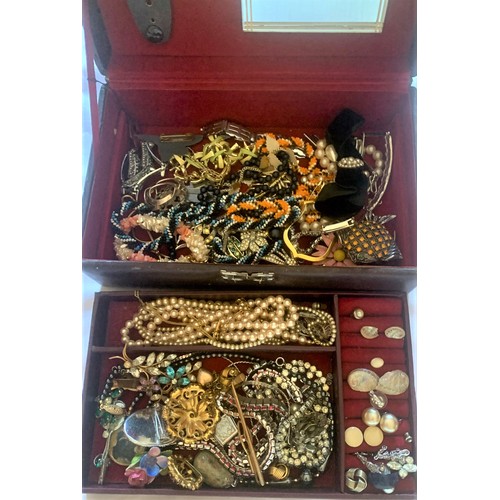 86 - A quantity of dress jewellery in a jewellery box.