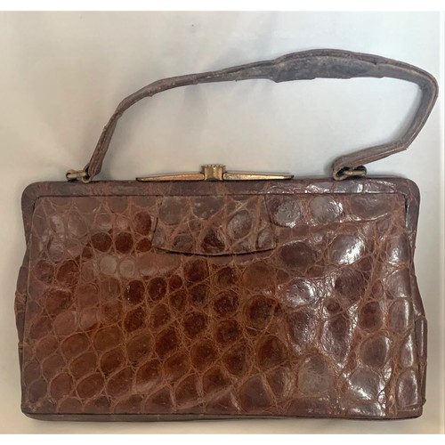 80 - A vintage crocodile skin handbag with suede  interior and two pockets, trade label named The Martin ... 