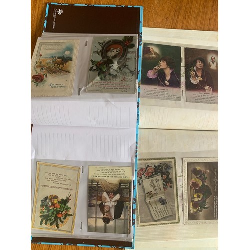 144 - Two albums of various greetings & other postcards.