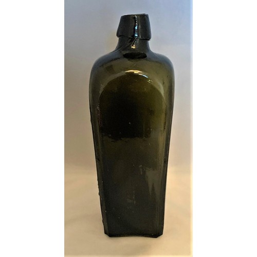 28 - A black glass pictorial gin bottle, late 19th century, embossed 'Cosmopoliet JJ Melchers wz Schiedam... 