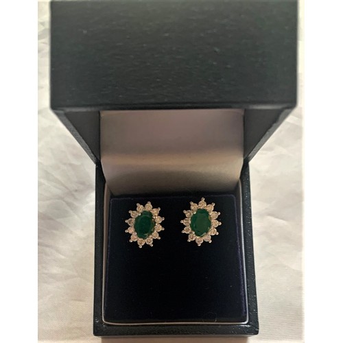 72 - Pair of 18 carat white gold Emerald and Diamond cluster Earrings total weight 2.2 carats.