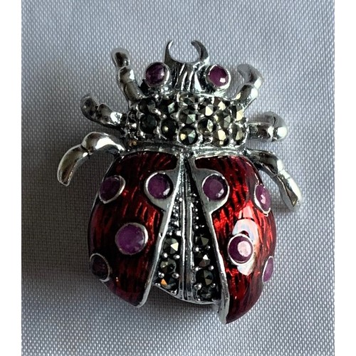 73 - A silver and enamel Ladybird brooch.