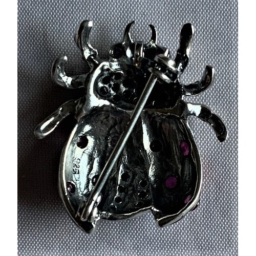 73 - A silver and enamel Ladybird brooch.