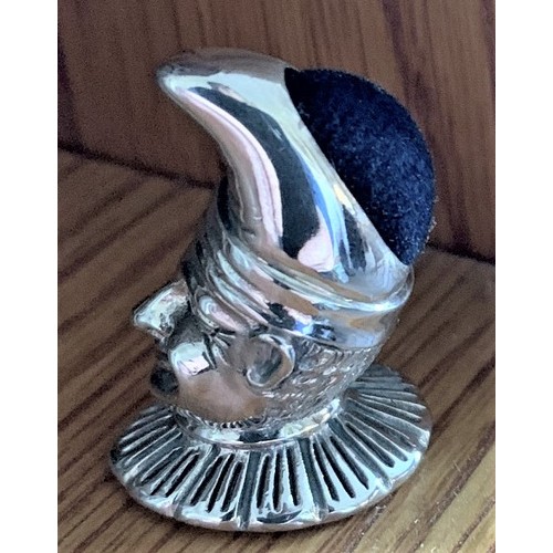 79 - A Sterling silver pin cushion in the form of a Court Jester, 10cm high.