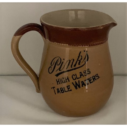 103 - Pink's Chichester Sussex, 'Pink's High Class Table Waters', two tone stoneware pub jug, 14 cm high a... 