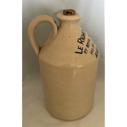 105 - A Guernsey stoneware flagon, white glaze, with black transfer 'Le Riches Stores Ltd. By Royal Appoin... 