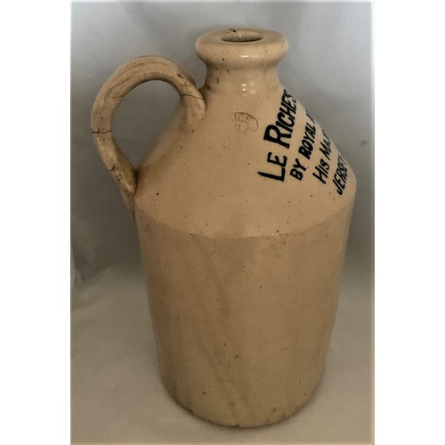 109 - A Guernsey white glazed stoneware flagon with black transfer 'Le Riches Stores Ltd. By Royal Appoint... 