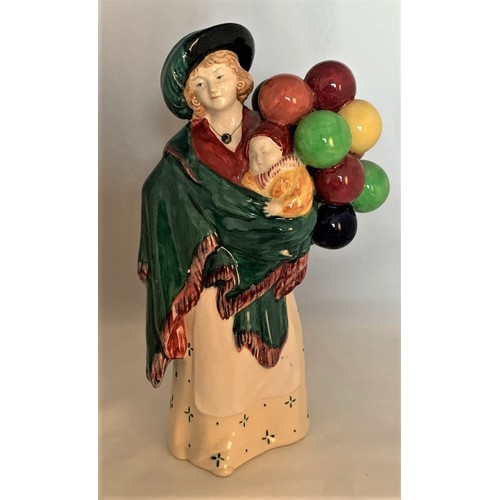 126 - Royal Doulton figure, The Balloon Seller, early edition, standing, model number HN 583 and impressed... 