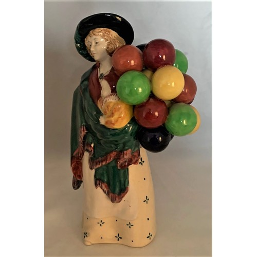 126 - Royal Doulton figure, The Balloon Seller, early edition, standing, model number HN 583 and impressed... 