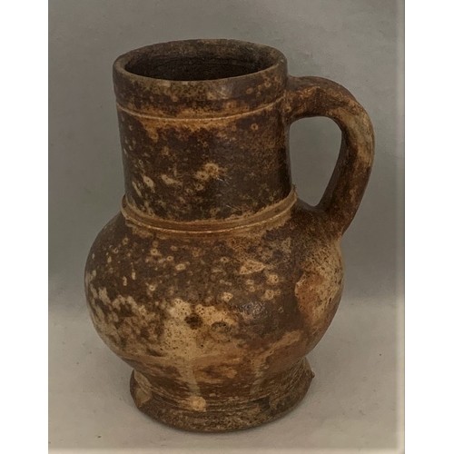 121 - A 17th century wide necked baluster small flagon, 14 cm high.