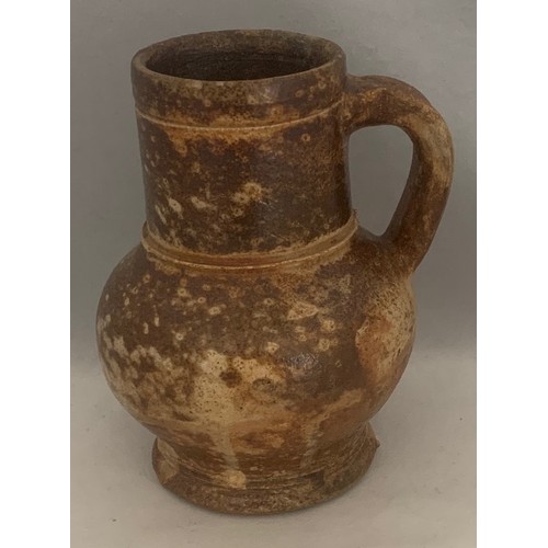 121 - A 17th century wide necked baluster small flagon, 14 cm high.