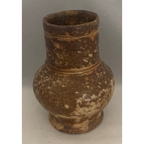 121 - A 17th century wide necked baluster small flagon, 14 cm high.