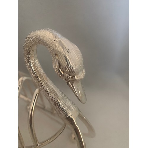 74 - A novelty silver plated Swan form six division toast rack, 20 cm wide 16 cm high.