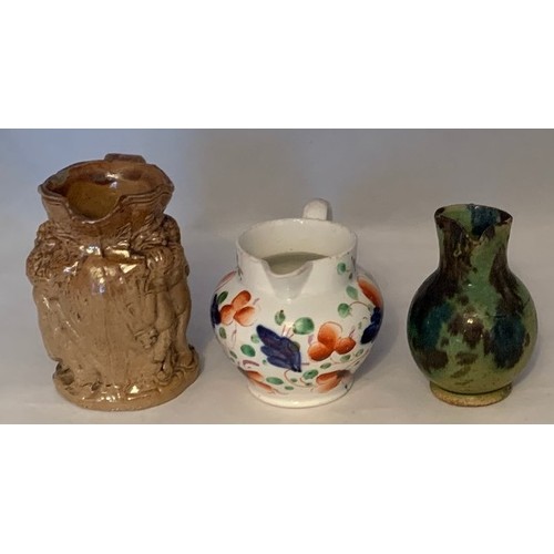 7 - Miniature saltglazed Bacchus jug 8 cm high, together with a miniature Swansea jug, 6 cm high and ano... 