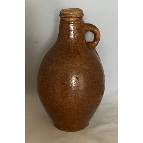 14 - German early 18th century salt glazed stoneware wine flagon, of ovoid form with ring handle, 26 cm h... 