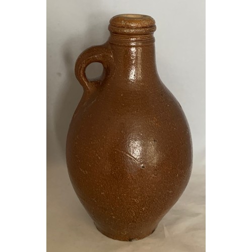 14 - German early 18th century salt glazed stoneware wine flagon, of ovoid form with ring handle, 26 cm h... 