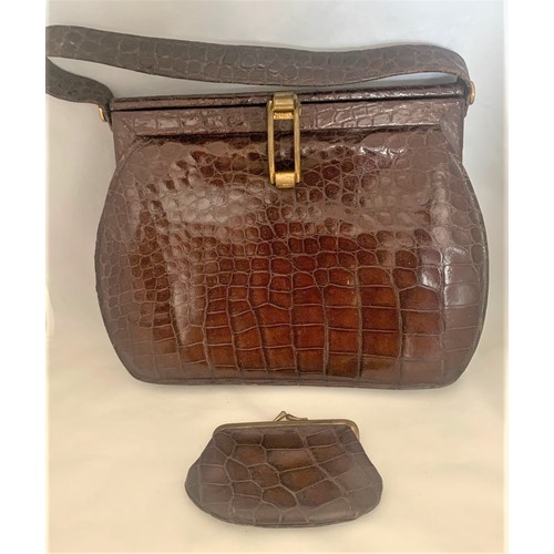 19 - A vintage crocodile skin handbag with suede  interior, the interior with trade label 'The Martin' wi... 