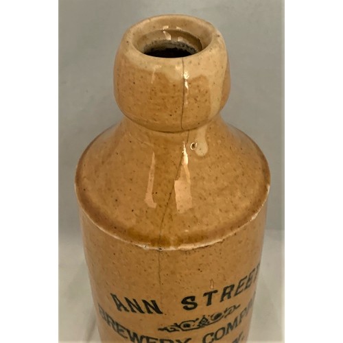 50 - A scarce Jersey ginger beer bottle with a honey coloured glaze, transfer printed 'Ann Street Brewery... 