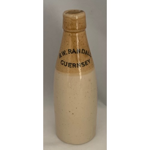 64 - R.W.Randall Guernsey, two tone stoneware Ginger Beer bottle, champagne shape.