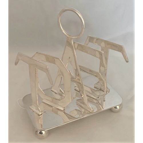 22 - A novelty silver plated four section toast rack.