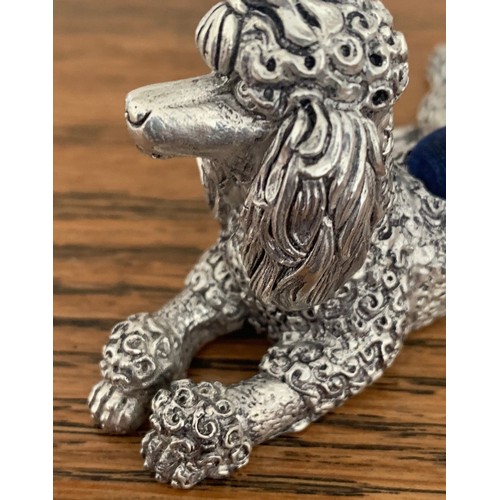 55 - 800 silver pin cushion, in the form of a seated poodle, total weight 70 gms 8 cm long.