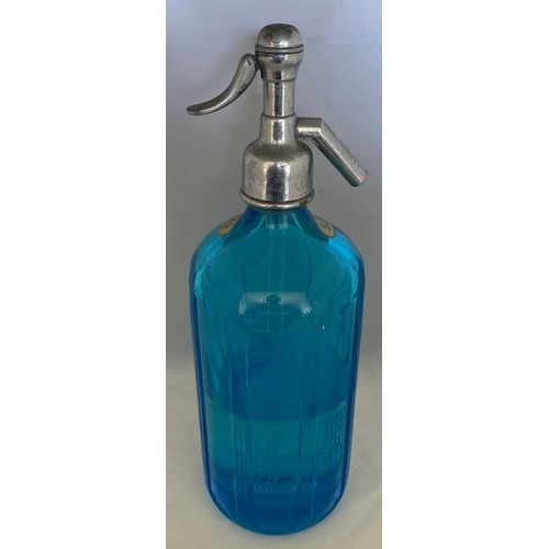 38 - A blue glass soda syphon, etched to the front E.W.Guppy St John's Hall Guernsey, 32 cm high.