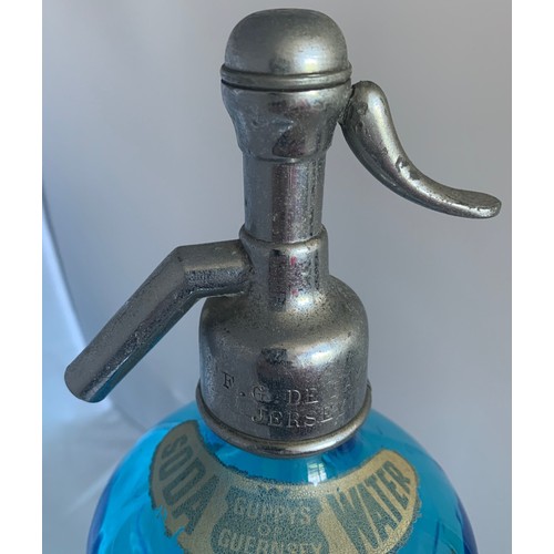 38 - A blue glass soda syphon, etched to the front E.W.Guppy St John's Hall Guernsey, 32 cm high.