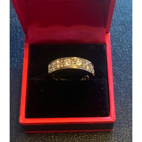 68 - 18 carat white gold diamond half eternity ring of 1.3 carats.