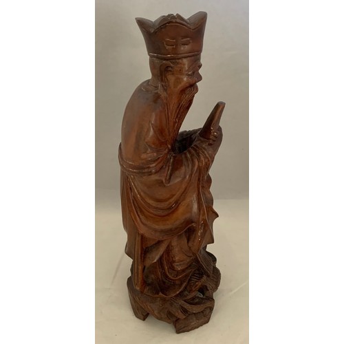 75 - Chinese finely carved hardwood figure depicting a Sage, 20cm high.