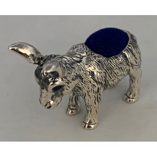 79 - A silver donkey pin cushion.