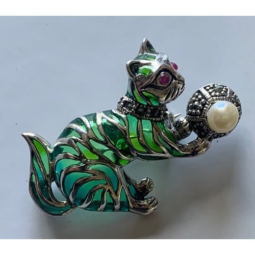 112 - Silver and plique a jour cat brooch with ruby eyes.