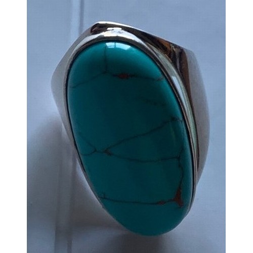 113 - A silver and turquoise dress ring.