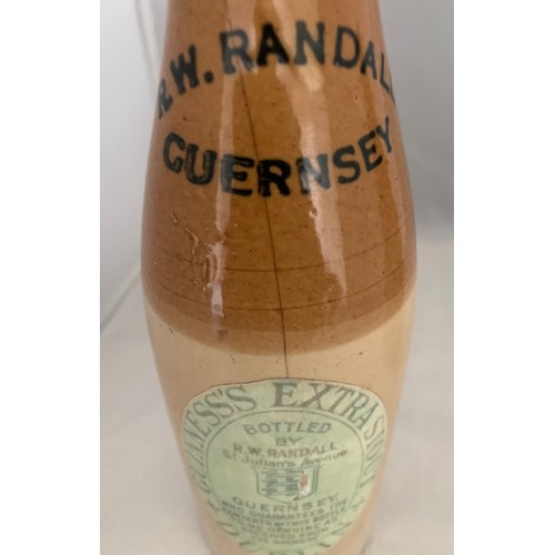 51 - Two R.W. Randall Guernsey Ginger Beer /Stout bottles, as found.