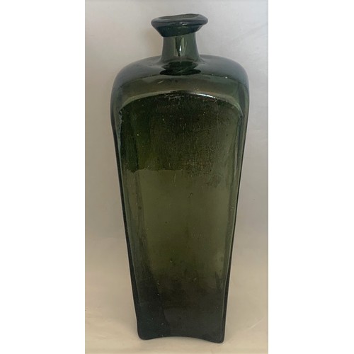 53 - An 18th century free blown green glass gin bottle 26 cm high.